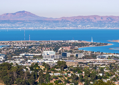 Aerial view of Walnut Creek, California. The water and mountains in the background.